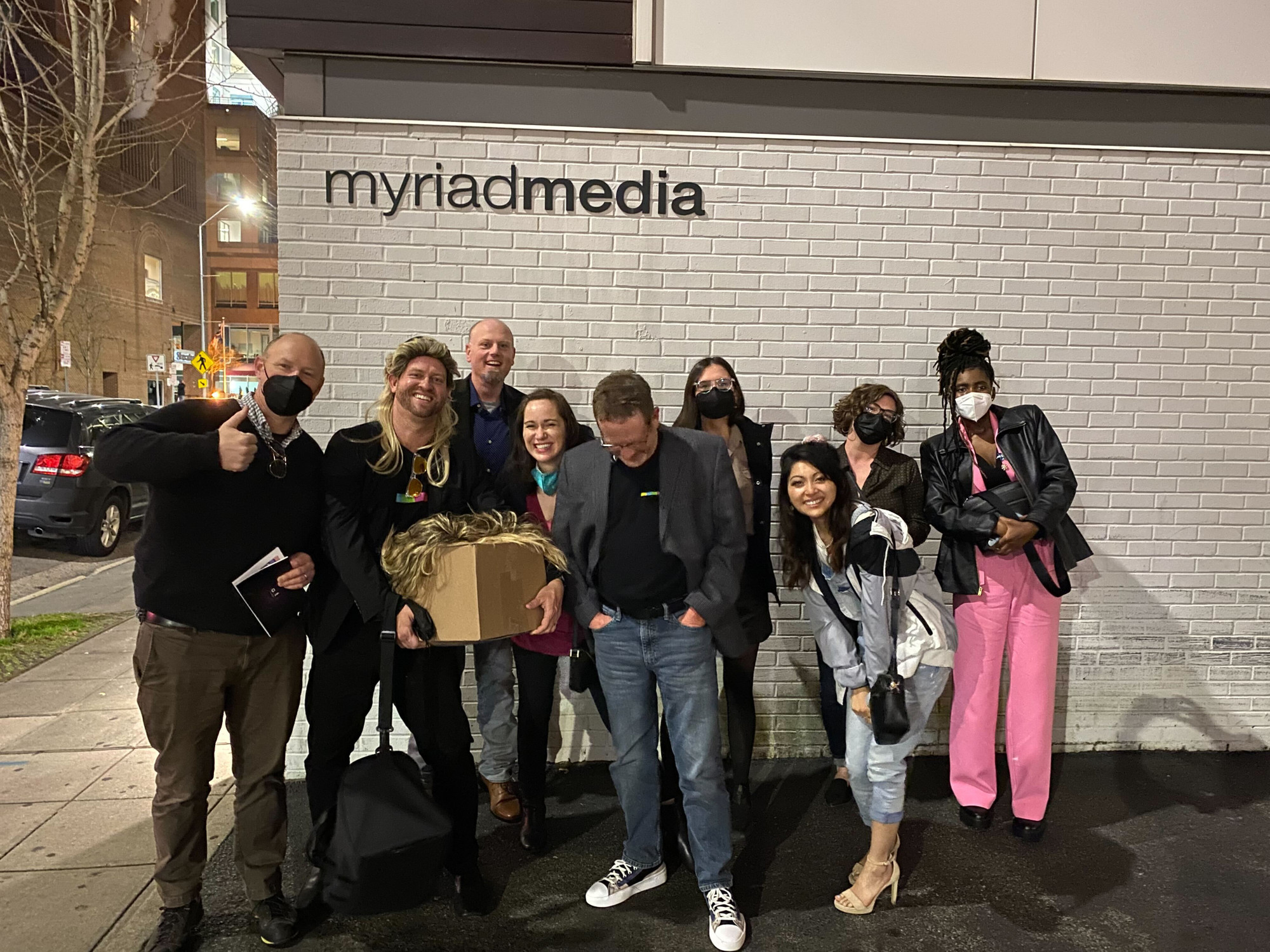 The Myriad team posing for a group photo outside the Myriad studio after winning the Addy Awards