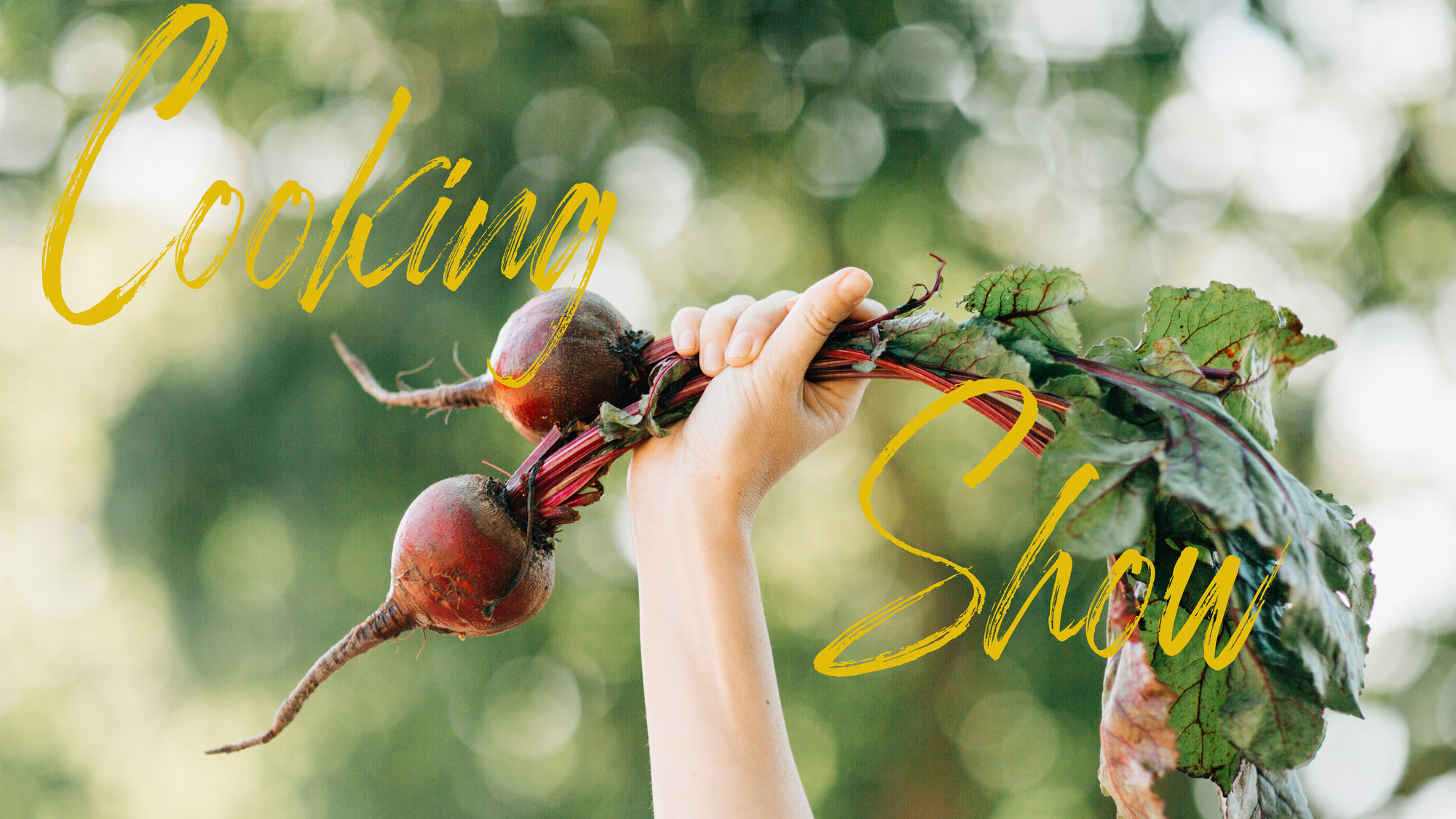 A single arm is shown holding up a pair of beets by their stems. ‘Cooking Show’ is written in cursive.